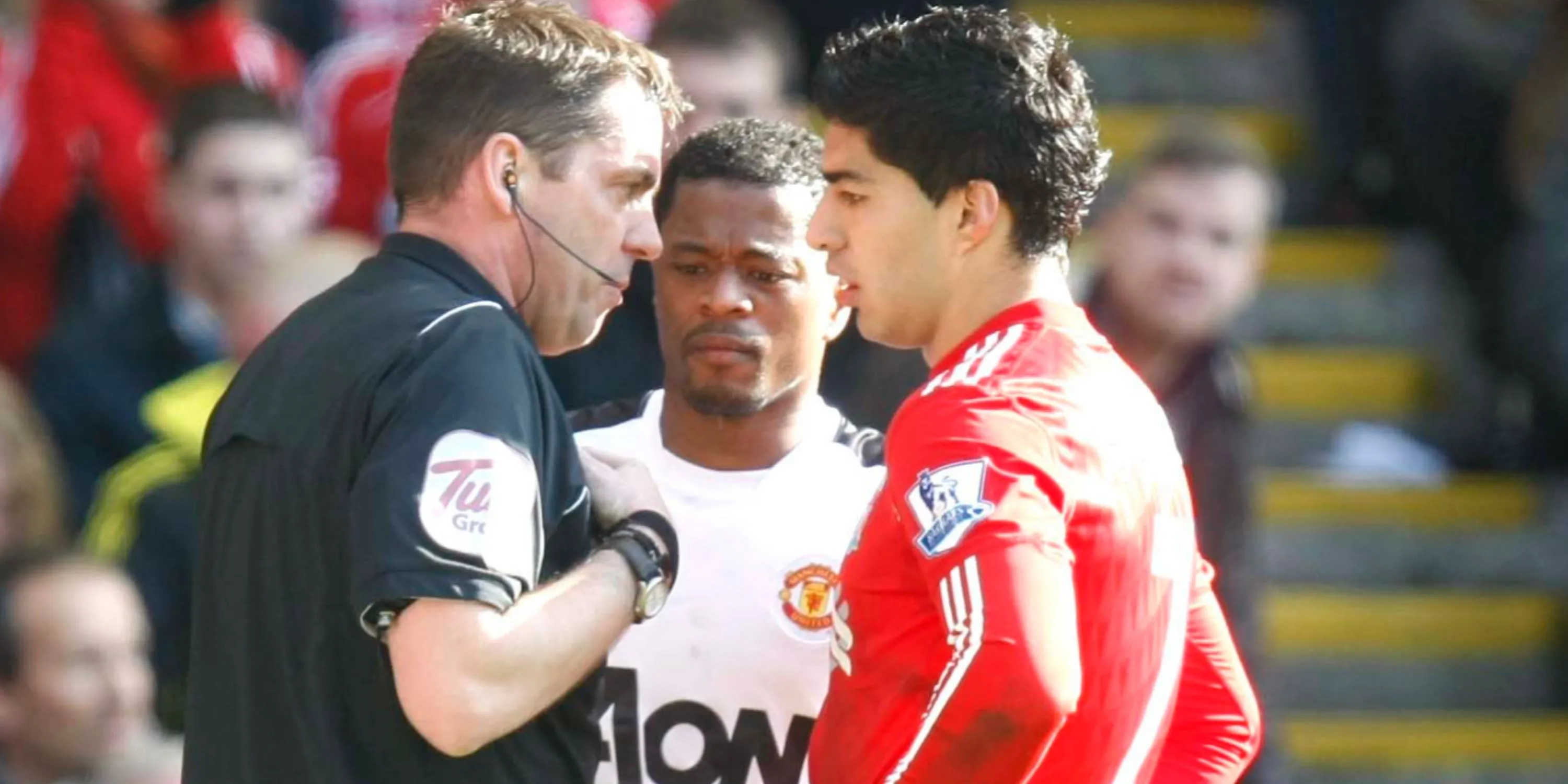Luis Suarez and Patrice Evra